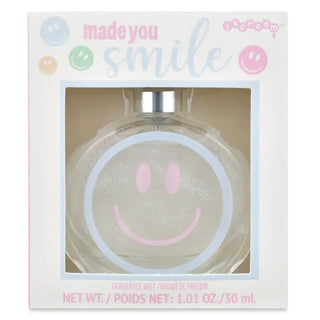 Perfume bottle with smiley face design in a 'made you smile' branded box.