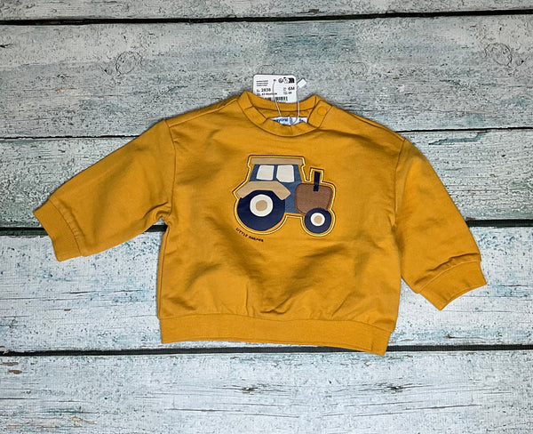 Mustard pullover with blue tractor