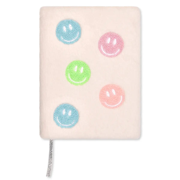 Notebook with colorful smiley face designs on a white background